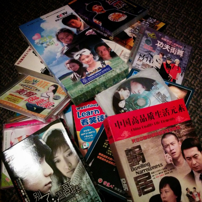 A collection of Mandarin Chinese-language DVDs and VCDs including TV drama series and instructional videos